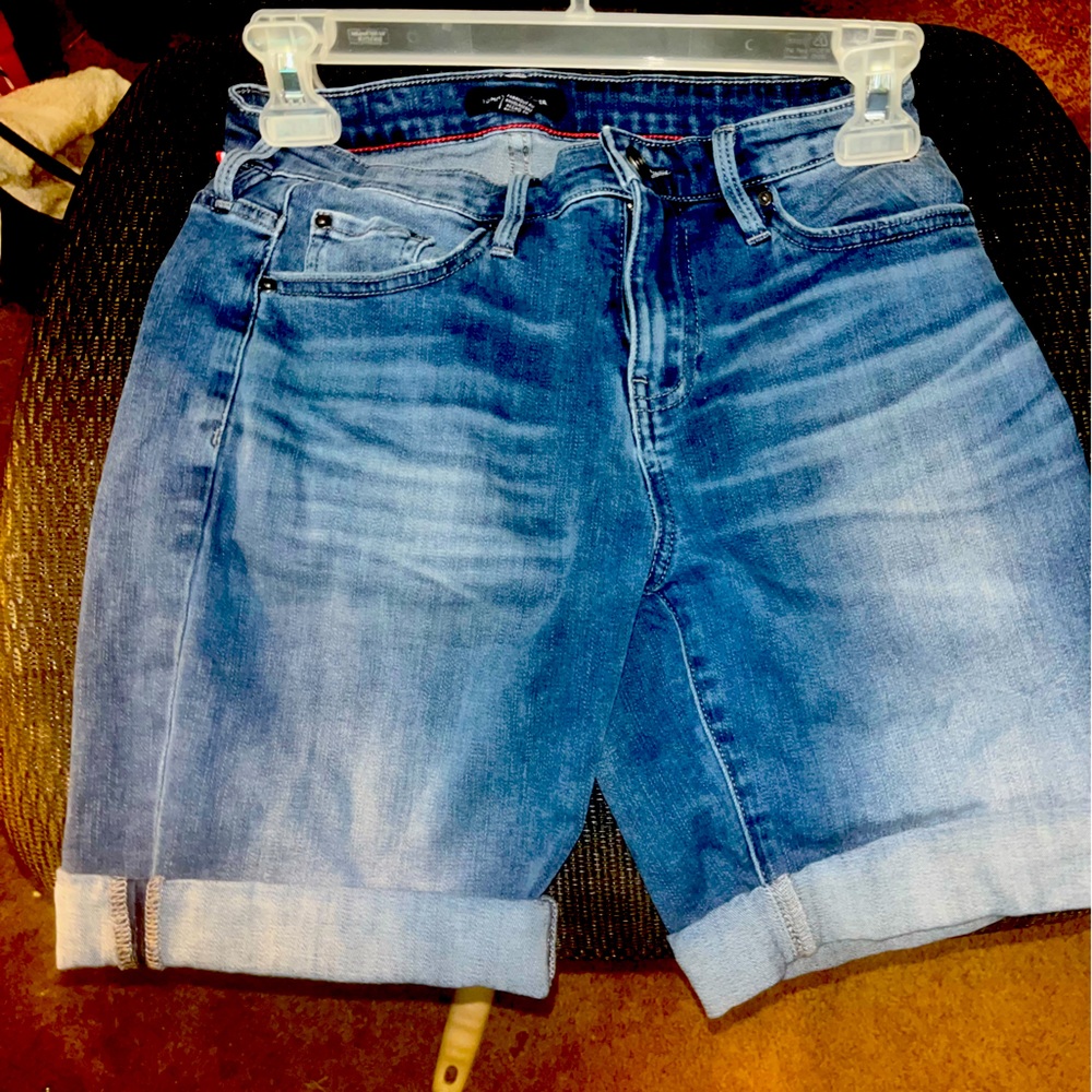 A nice pair of blue jeans shorts worn but still in good shape